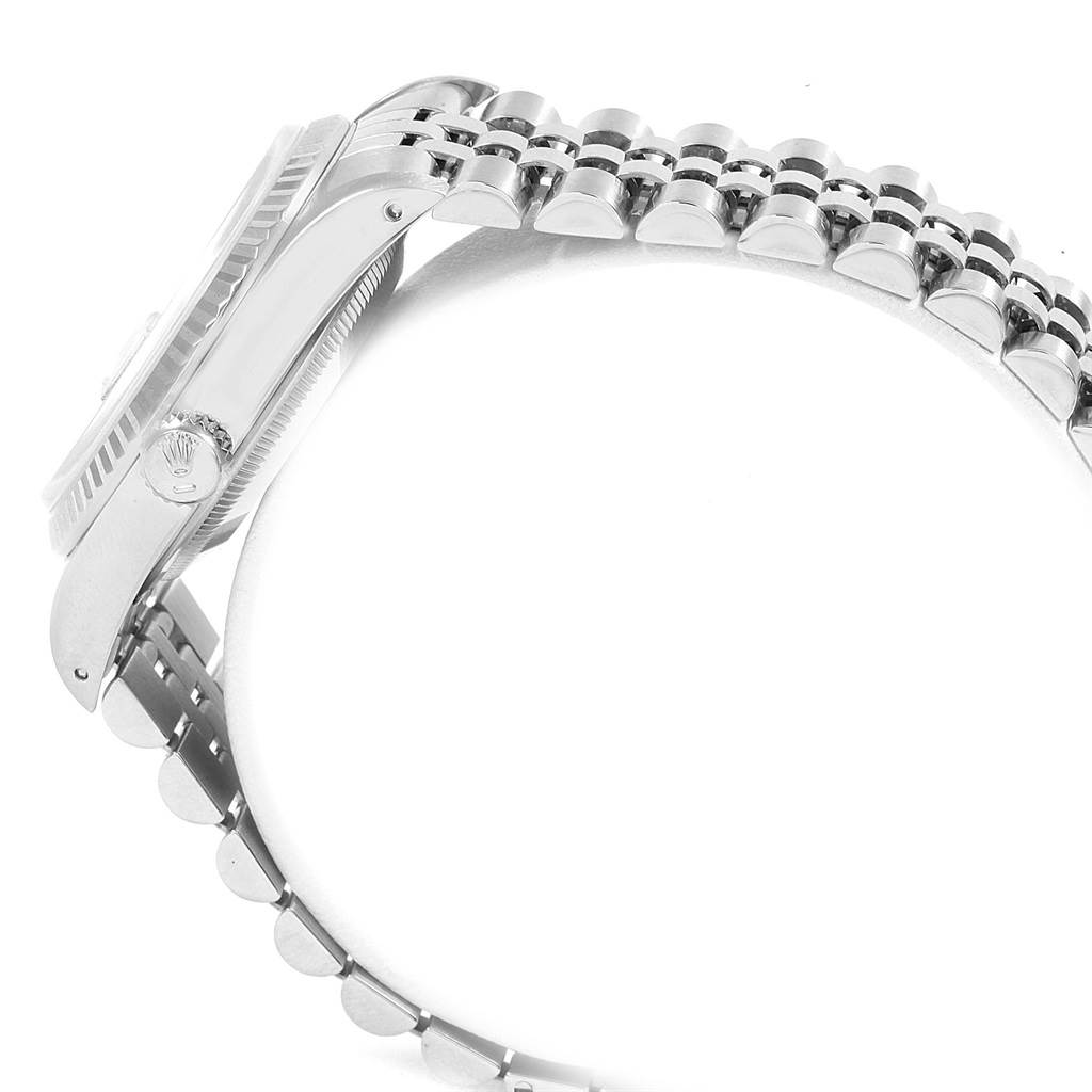 This side view of the Rolex Datejust 16234 Men's Stainless Steel Silver Dial 16234 Men's Stainless Steel Silver Dial watch shows the case, crown, and part of the bracelet.