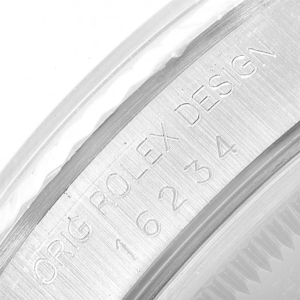 This close-up image shows the engraved details on the case back of a Rolex Datejust 16234 Men's Stainless Steel Silver Dial 16234 Men's Stainless Steel Silver Dial watch.