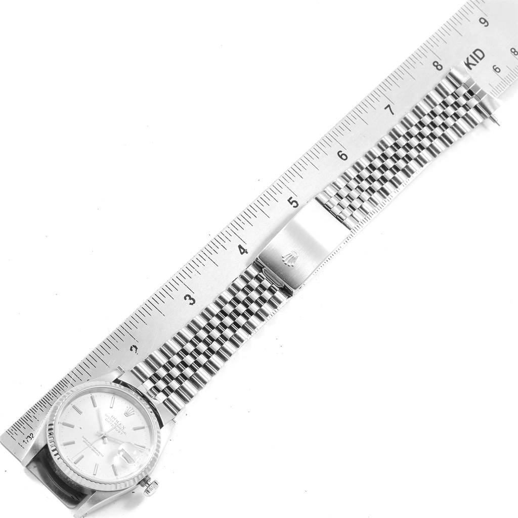 The image shows a Rolex Datejust 16234 Men's Stainless Steel Silver Dial 16234 Men's Stainless Steel Silver Dial watch lying flat, with a ruler measuring its jubilee bracelet and clasp.
