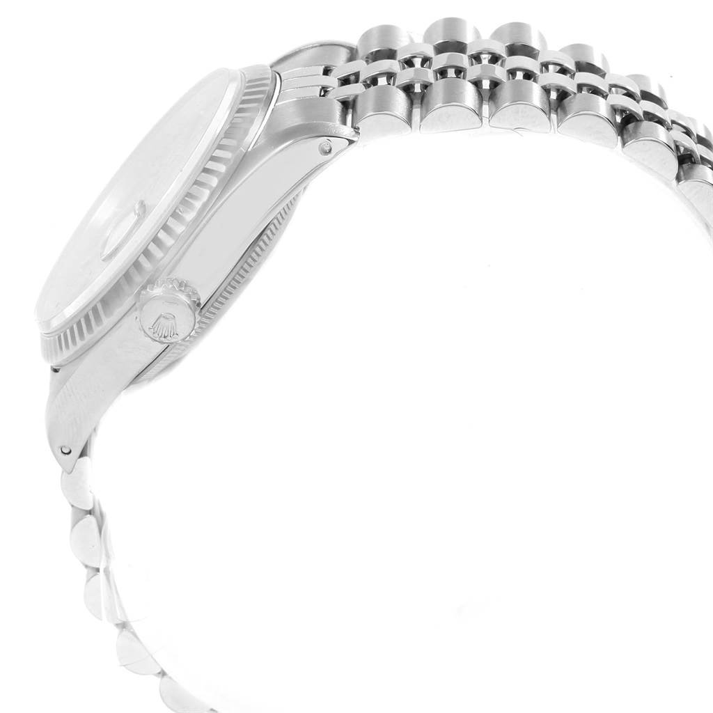 The image shows a side view of the Rolex Datejust 16234 Men's Stainless Steel Silver Dial 16234 Men's Stainless Steel Silver Dial watch, highlighting the crown, case, and part of the bracelet.