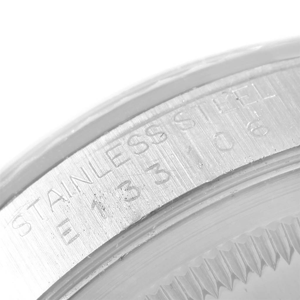 This is a close-up angle showing the stainless steel bezel with engraved details of the Rolex Datejust 16234 Men's Stainless Steel Silver Dial 16234 Men's Stainless Steel Silver Dial watch.