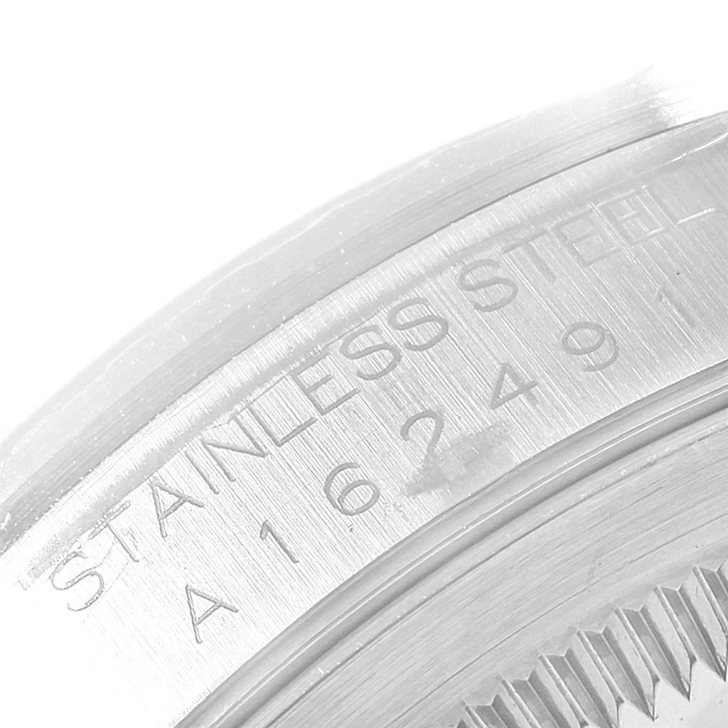 This close-up image shows the stainless steel serial number engraving on a Rolex Datejust 16220 Men
s Stainless Steel Blue Dial 16220 Men
s Stainless Steel Blue Dial watch.
