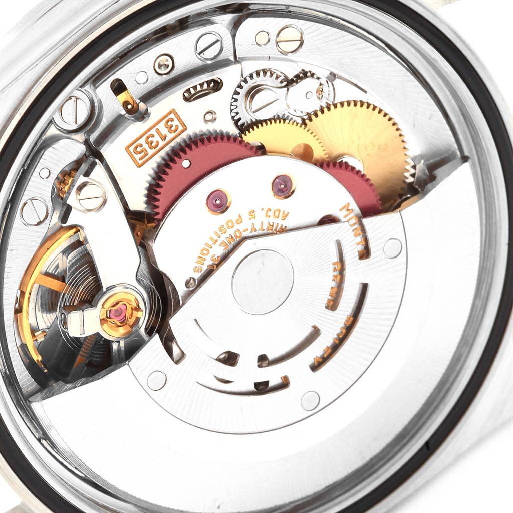 This close-up image of a Rolex Datejust 16220 Men
s Stainless Steel Blue Dial 16220 Men
s Stainless Steel Blue Dial watch shows the movement and intricate inner components.