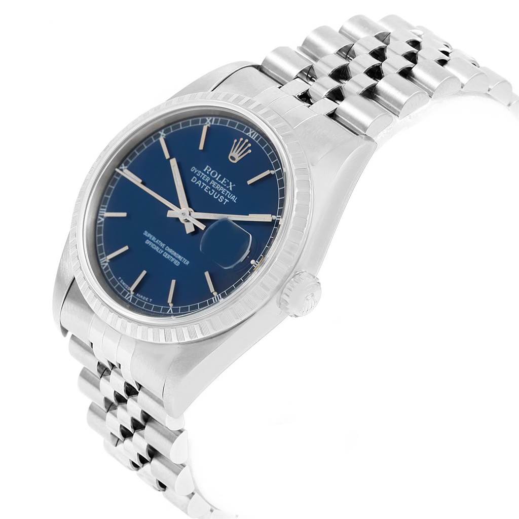 The image shows a Rolex Datejust 16220 Men
s Stainless Steel Blue Dial 16220 Men
s Stainless Steel Blue Dial watch at a slight angle, highlighting the blue dial, fluted bezel, and Jubilee bracelet.