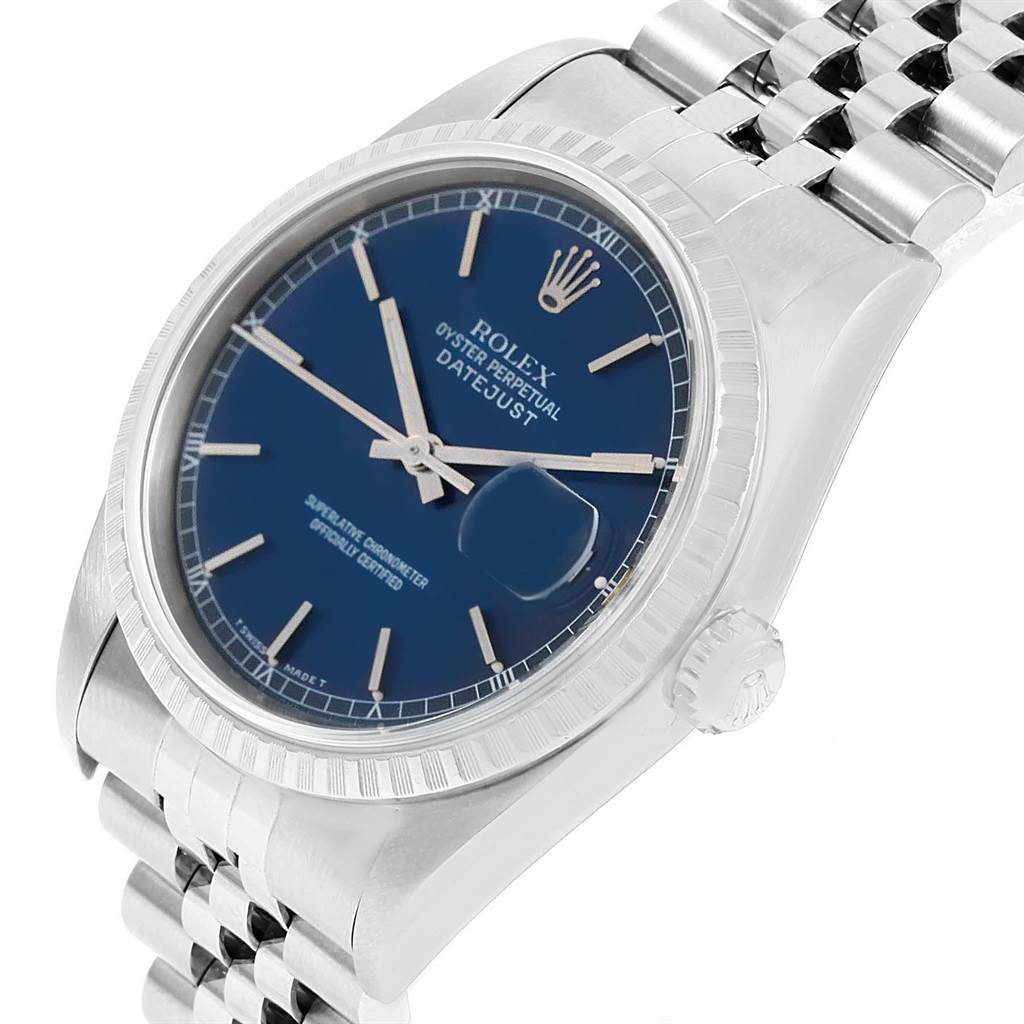 The image shows a Rolex Datejust 16220 Men
s Stainless Steel Blue Dial 16220 Men
s Stainless Steel Blue Dial watch from an angled side view, highlighting its blue dial, bezel, crown, and jubilee bracelet.