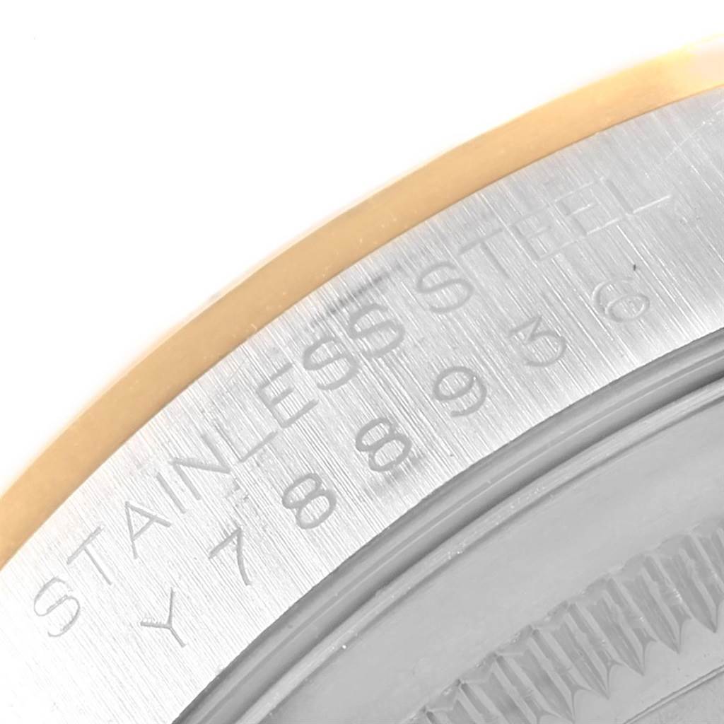 This image shows a close-up of the stainless steel case back with serial number engraving on a Rolex Datejust 20413 Men's Steel and Gold (two tone) Champagne Dial 20413 Men's Steel and Gold (two tone) Champagne Dial model watch.