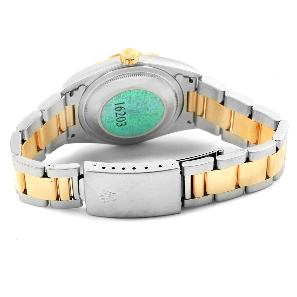 This image shows the back of a Rolex Datejust 20413 Men's Steel and Gold (two tone) Champagne Dial 20413 Men's Steel and Gold (two tone) Champagne Dial watch, highlighting its clasp and two-tone bracelet.