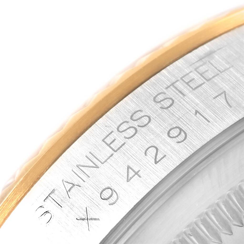 The image shows a close-up angle of the case side and bezel of the Rolex Datejust 16233 Men
s Steel and Gold (two tone) Blue Dial 16233 Men
s Steel and Gold (two tone) Blue Dial, highlighting the "STAINLESS STEEL" inscription.