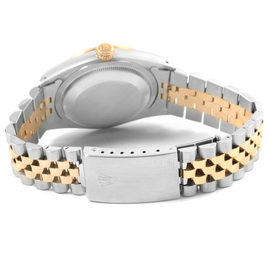 The image shows the backside, bracelet, and clasp of a Rolex Datejust 16233 Men
s Steel and Gold (two tone) Blue Dial 16233 Men
s Steel and Gold (two tone) Blue Dial watch.