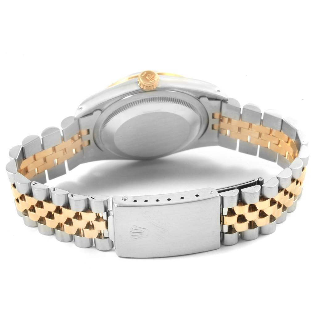 This image shows the back view of a Rolex Datejust 16233 Men
s Steel and Gold (two tone) Black Dial 16233 Men
s Steel and Gold (two tone) Black Dial watch, highlighting the clasp and two-tone bracelet.