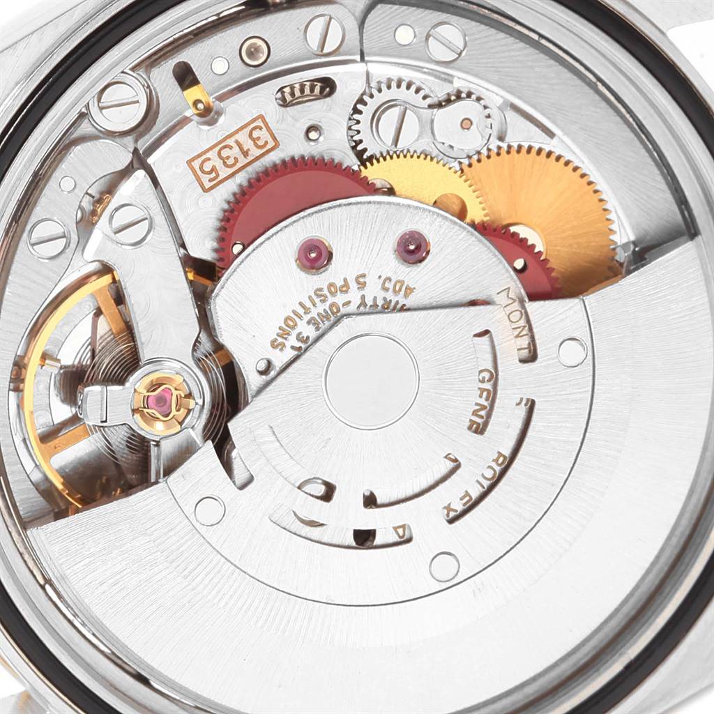 The image shows the internal mechanism of a Rolex Datejust 16233 Men
s Steel and Gold (two tone) Black Dial 16233 Men
s Steel and Gold (two tone) Black Dial watch from a close-up, rear angle.