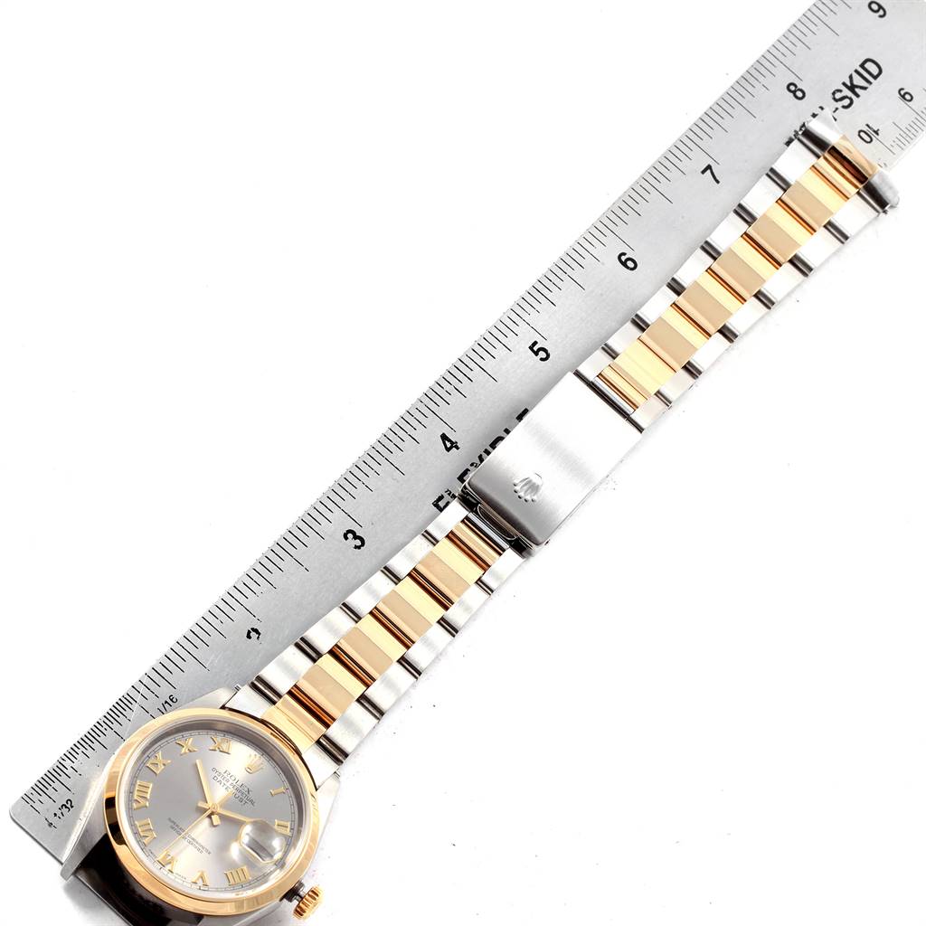 The image shows a Rolex Datejust 16203 Men's Steel and Gold (two tone) Grey Dial 16203 Men's Steel and Gold (two tone) Grey Dial watch lying flat next to a ruler, displaying its face, bezel, bracelet, and clasp.