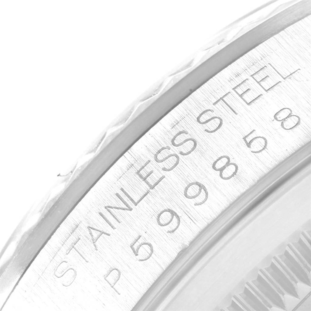 The image shows a close-up of the serial number and stainless steel details on the bezel of a Rolex Datejust 16234 Men's Stainless Steel White Dial 16234 Men's Stainless Steel White Dial watch.