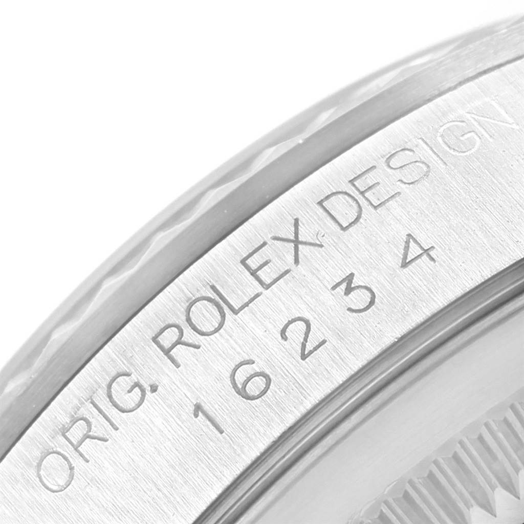 This close-up shot shows the engraved case back of a Rolex Datejust 16234 Men's Stainless Steel White Dial 16234 Men's Stainless Steel White Dial watch, emphasizing the "ORIG. ROLEX DESIGN" text and model number.