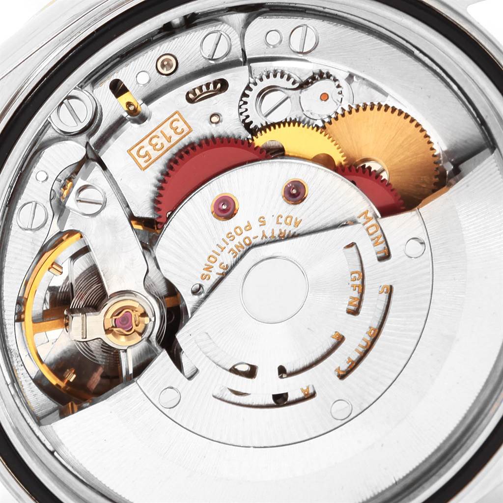 This image shows a close-up view of the Rolex Datejust 16233 Men's Steel and Gold (two tone) Champagne Dial 16233 Men's Steel and Gold (two tone) Champagne Dial movement and internal mechanism components.