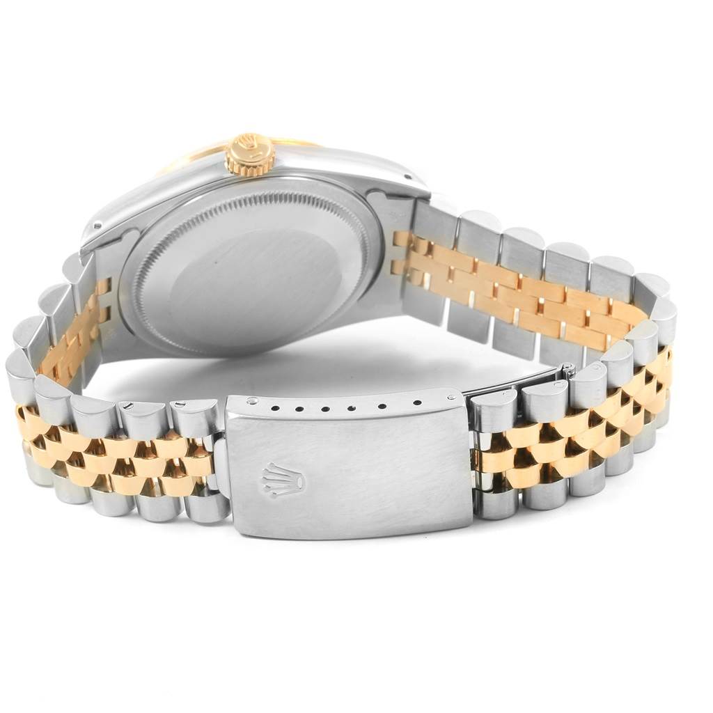 The image shows the back and clasp of a Rolex Datejust 16233 Men's Steel and Gold (two tone) Champagne Dial 16233 Men's Steel and Gold (two tone) Champagne Dial watch, highlighting its two-tone bracelet.