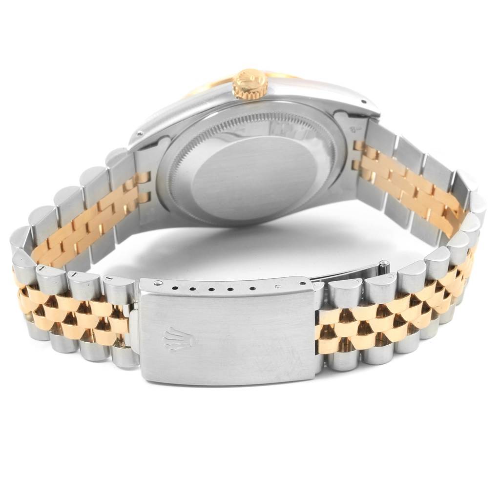 The image shows the back of a Rolex Datejust 16233 Men's Steel and Gold (two tone) Champagne Dial 16233 Men's Steel and Gold (two tone) Champagne Dial watch, highlighting its two-tone bracelet and clasp.
