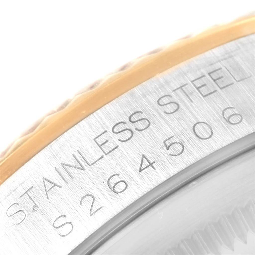This image shows a close-up of the serial number engraving on the stainless steel side of a Rolex Datejust 16233 Men's Steel and Gold (two tone) Champagne Dial 16233 Men's Steel and Gold (two tone) Champagne Dial watch.