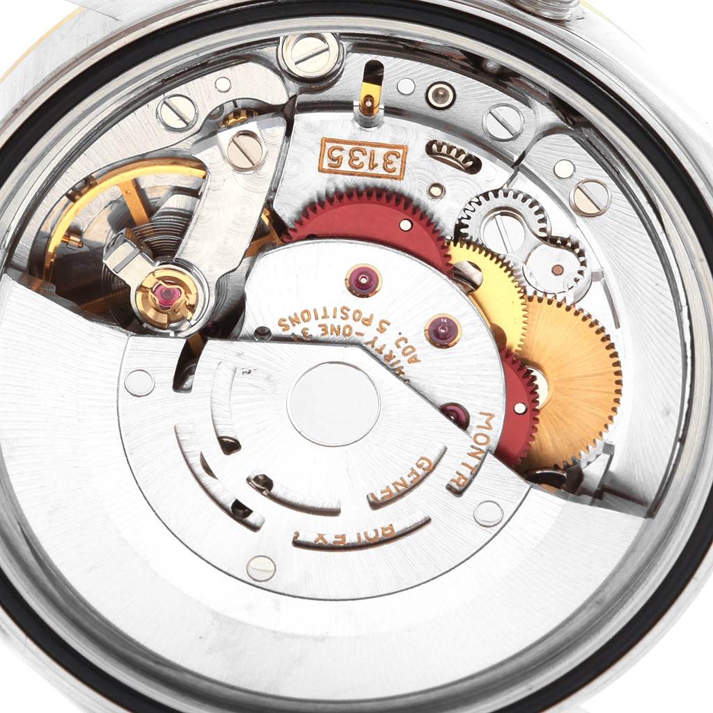 This image shows the inner mechanical movement and components of the Rolex Datejust 16233 Men's Steel and Gold (two tone) Champagne Dial 16233 Men's Steel and Gold (two tone) Champagne Dial watch from a rear angle.