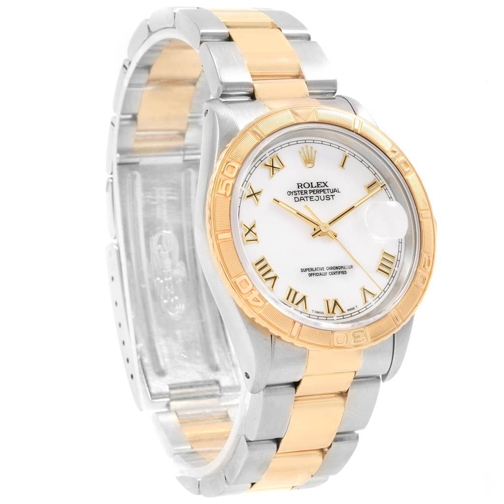 This image shows a Rolex Datejust 16263 Men
s Steel and Gold (two tone) White Dial 16263 Men
s Steel and Gold (two tone) White Dial watch at a three-quarter angle, displaying the face, bezel, and part of the bracelet.