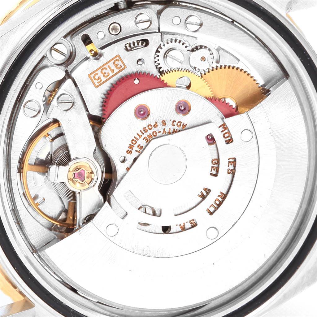 The image shows the internal mechanism and movement of a Rolex Datejust 16263 Men
s Steel and Gold (two tone) White Dial 16263 Men
s Steel and Gold (two tone) White Dial watch from a close-up view.