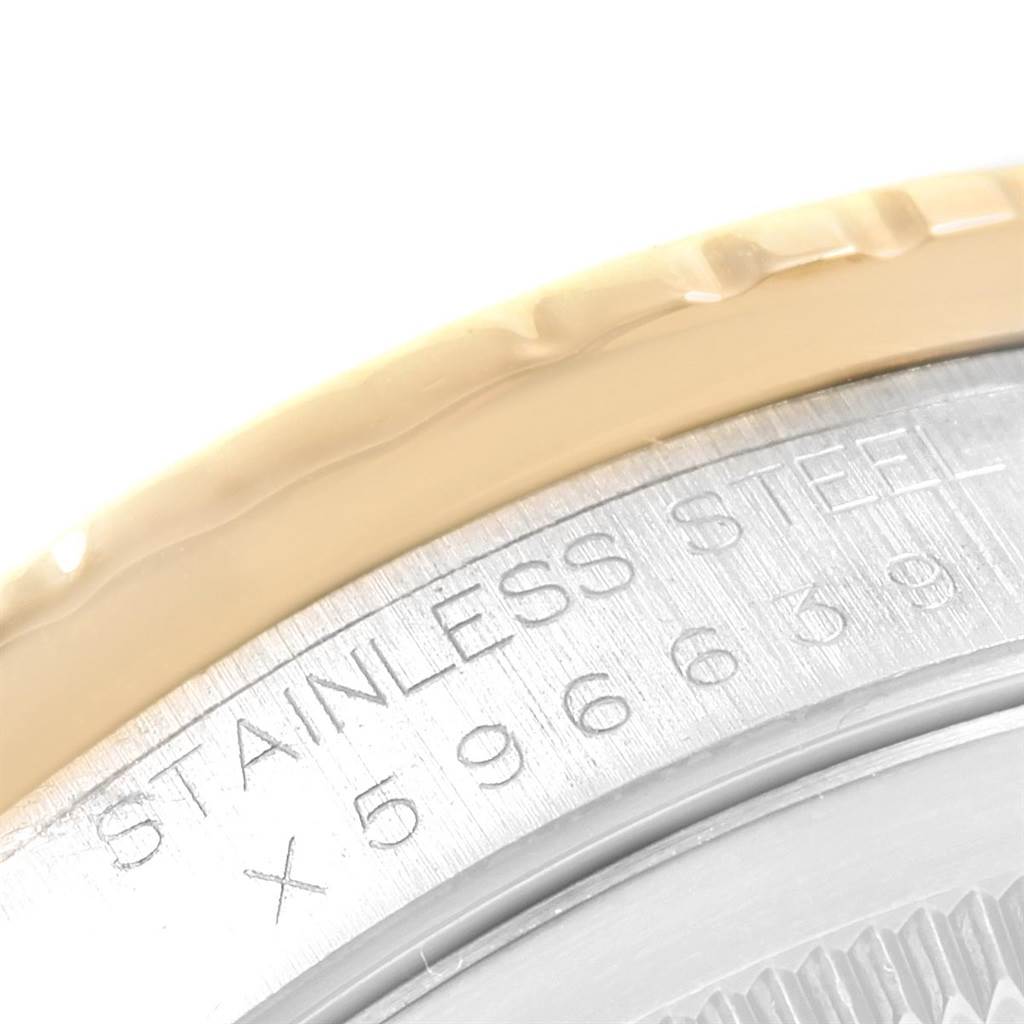 Close-up of the case back of a Rolex Datejust 16263 Men
s Steel and Gold (two tone) White Dial 16263 Men
s Steel and Gold (two tone) White Dial, featuring an inscription of "STAINLESS STEEL" and part of the serial number.