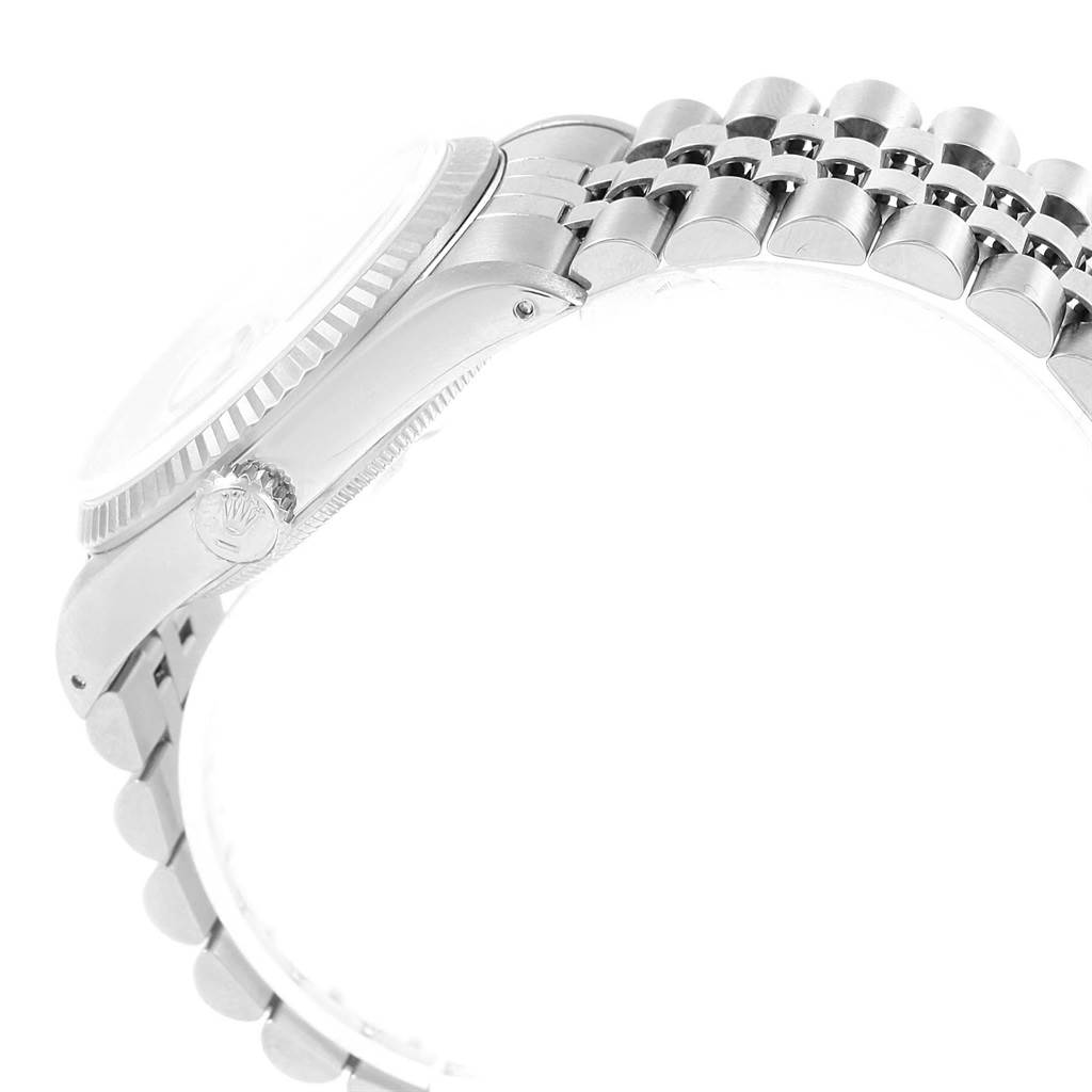 This image shows a side view of a Rolex Datejust 16234 Men
s Stainless Steel White Dial 16234 Men
s Stainless Steel White Dial, highlighting the crown, bezel, and partially the bracelet.