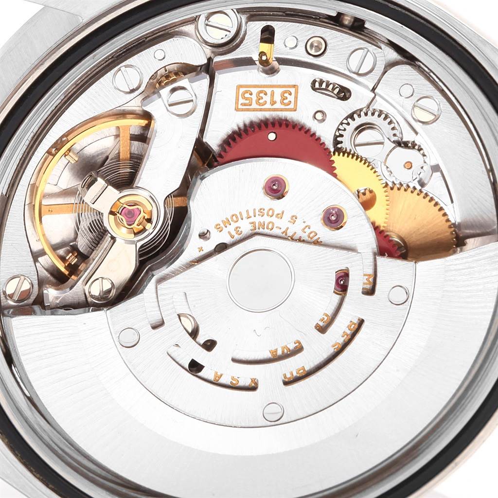 The image shows the internal mechanism of a Rolex Datejust 16200 Men's Stainless Steel Black Dial 16200 Men's Stainless Steel Black Dial watch, focusing on gears and movement components.