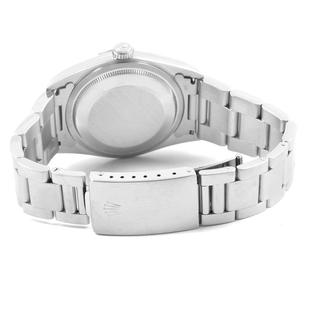 The image shows the back case and closed clasp of a Rolex Datejust 16200 Men's Stainless Steel Black Dial 16200 Men's Stainless Steel Black Dial watch, with the bracelet spread open.