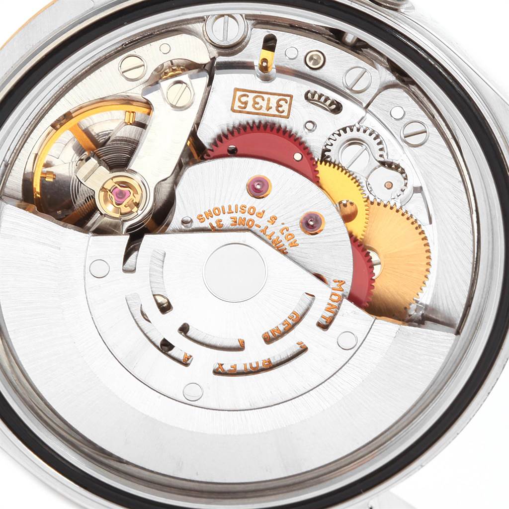 This image shows the intricate inner mechanical movement of a Rolex Datejust 16233 Men
s Steel and Gold (two tone) Champagne Dial 16233 Men
s Steel and Gold (two tone) Champagne Dial watch from a top-down angle.