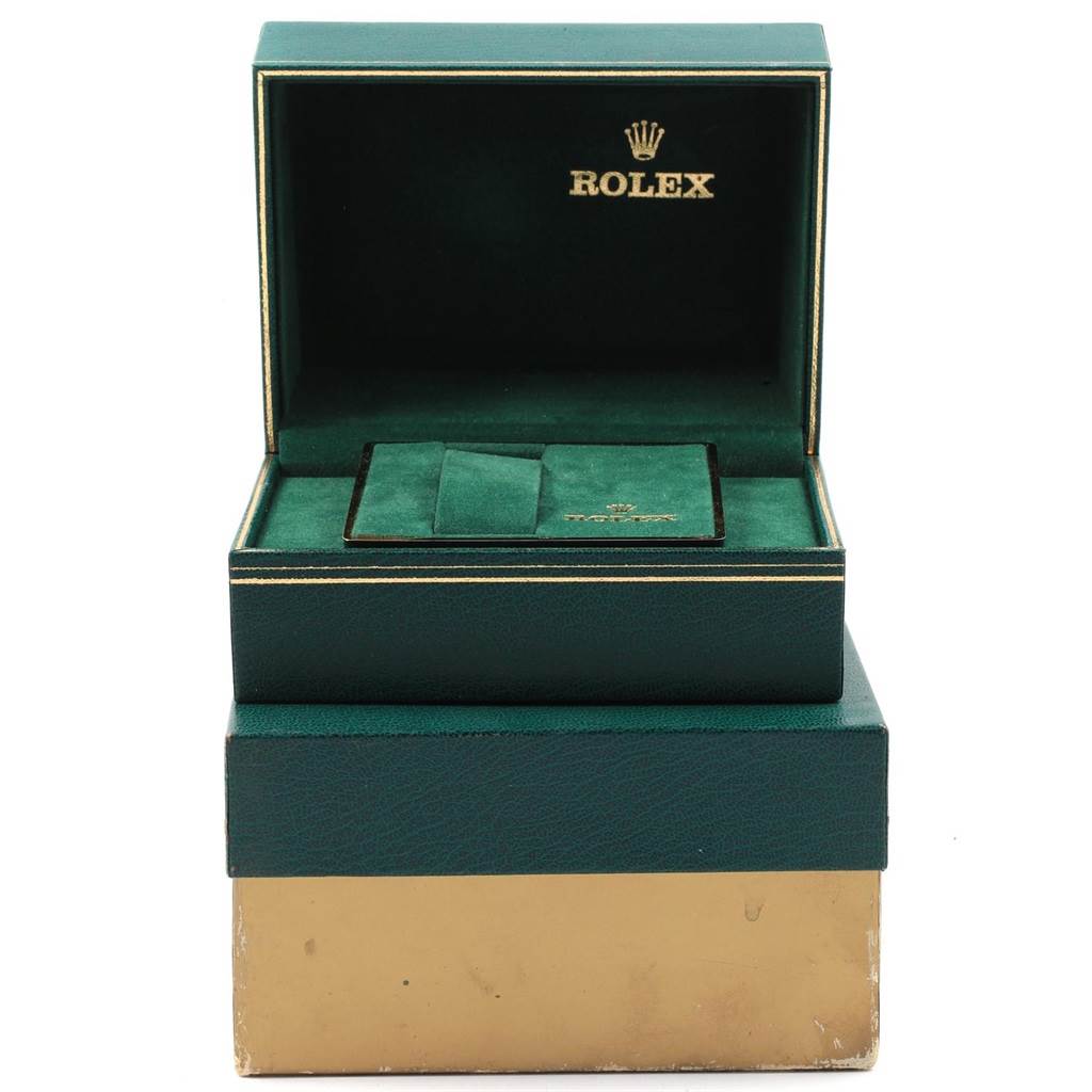 This image shows a Rolex Datejust 16013 Men
s Stainless Steel Champagne Dial 16013 Men
s Stainless Steel Champagne Dial model
s green watch box with its lid open, revealing the interior.