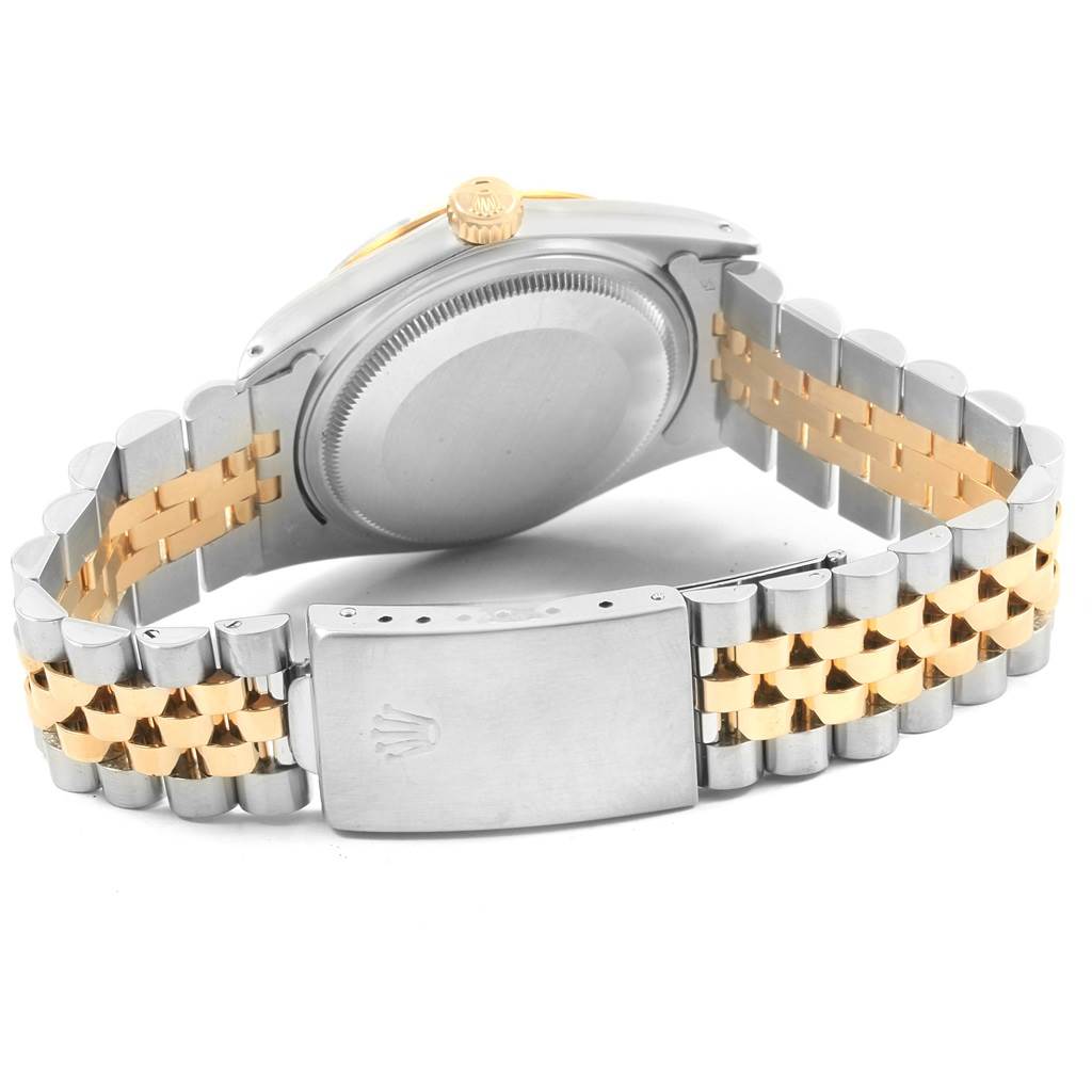 This image shows the back view of a Rolex Datejust 16013 Men
s Stainless Steel Champagne Dial 16013 Men
s Stainless Steel Champagne Dial watch, highlighting the case, crown, and two-tone jubilee bracelet with clasp.