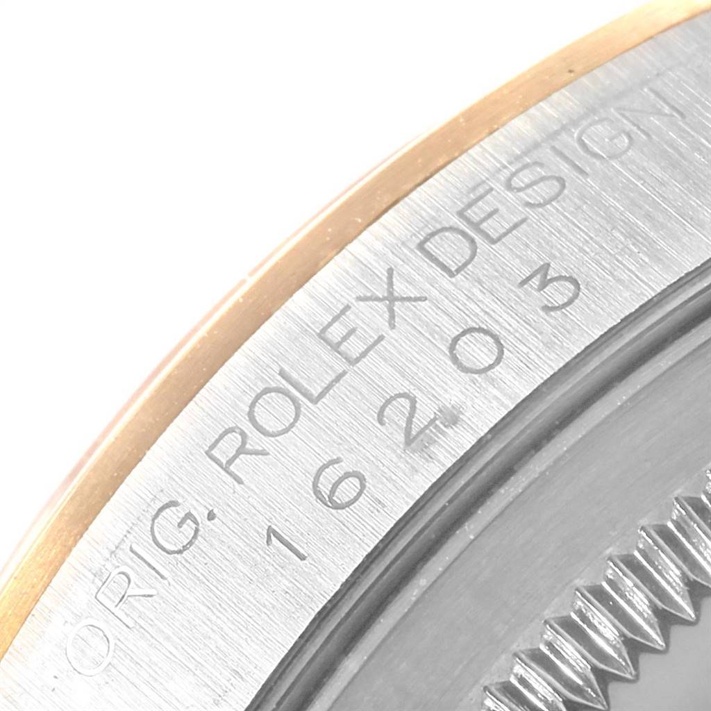 This image shows a close-up of the Rolex Datejust 16203 Men's Steel and Gold (two tone) Grey Dial 16203 Men's Steel and Gold (two tone) Grey Dial's case with engraved model details.