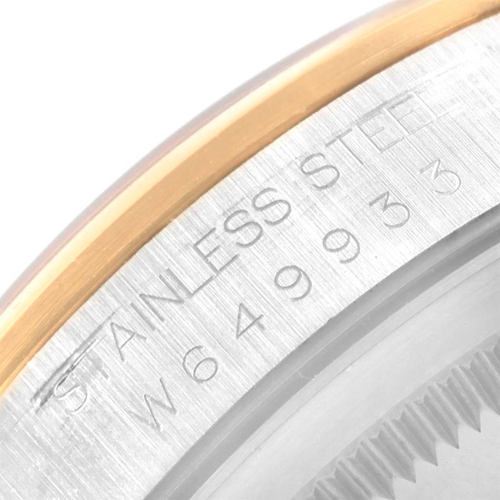 This image shows a detailed view of the serial number engraving on the stainless steel case of a Rolex Datejust 16203 Men's Steel and Gold (two tone) Grey Dial 16203 Men's Steel and Gold (two tone) Grey Dial watch.