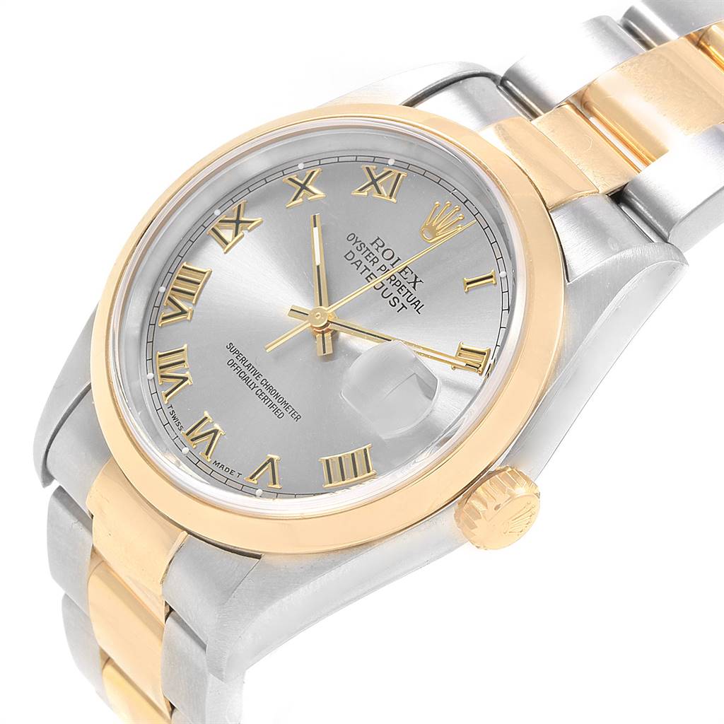 The Rolex Datejust 16203 Men's Steel and Gold (two tone) Grey Dial 16203 Men's Steel and Gold (two tone) Grey Dial watch is shown from an angled side view, displaying its face, bezel, crown, and part of the bracelet.