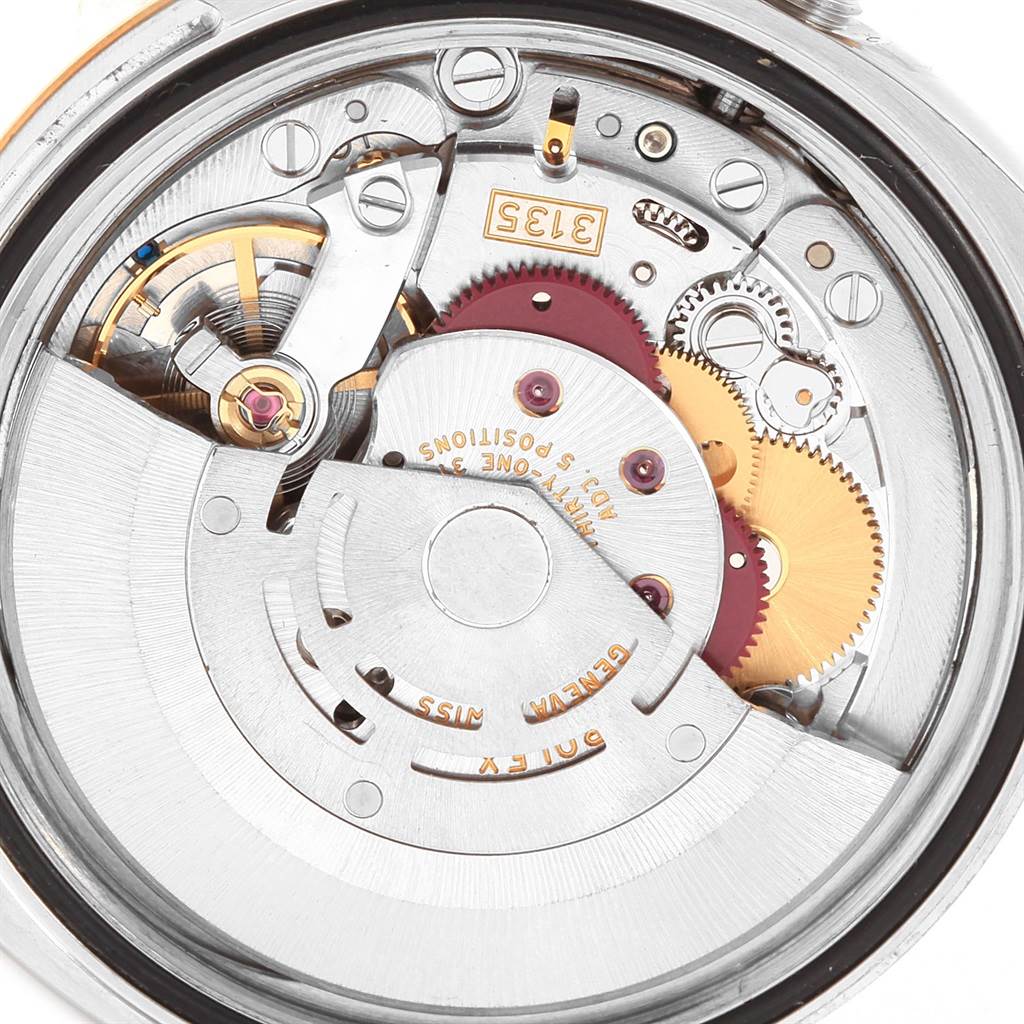 This image shows the internal mechanism and gears of a Rolex Datejust 116233 Men's Stainless Steel White Dial 116233 Men's Stainless Steel White Dial watch from an overhead view.