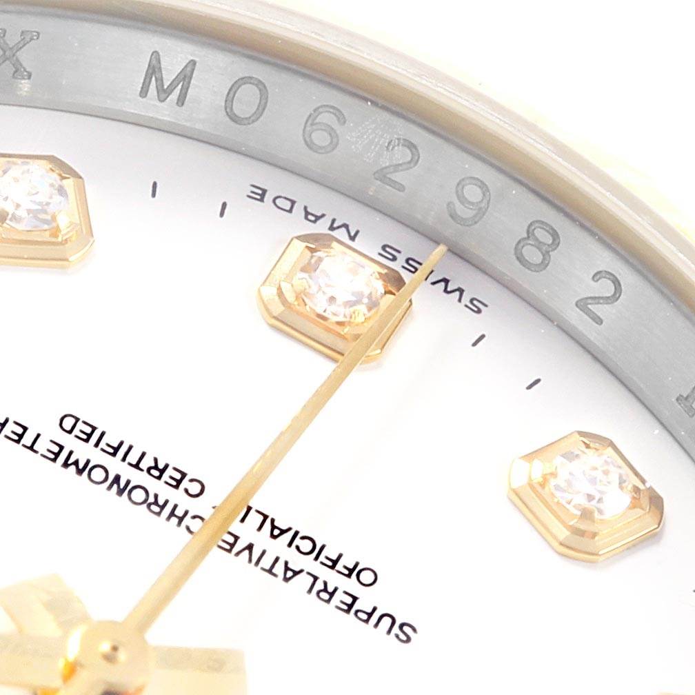 The image shows a close-up of the dial and markers of a Rolex Datejust 116233 Men's Stainless Steel White Dial 116233 Men's Stainless Steel White Dial watch, highlighting the serial number and diamond hour markers.