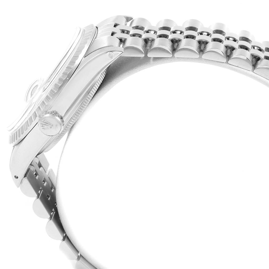 This image shows a side view of a Rolex Datejust 16030 Men
s Stainless Steel Silver Dial 16030 Men
s Stainless Steel Silver Dial watch, highlighting the crown, bezel, and part of the bracelet.