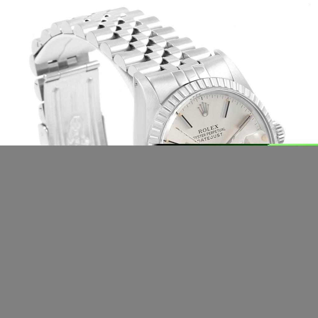 The image shows a partial view of a Rolex Datejust 16030 Men
s Stainless Steel Silver Dial 16030 Men
s Stainless Steel Silver Dial watch, capturing the dial, bezel, and part of the bracelet from an angled top-side perspective.