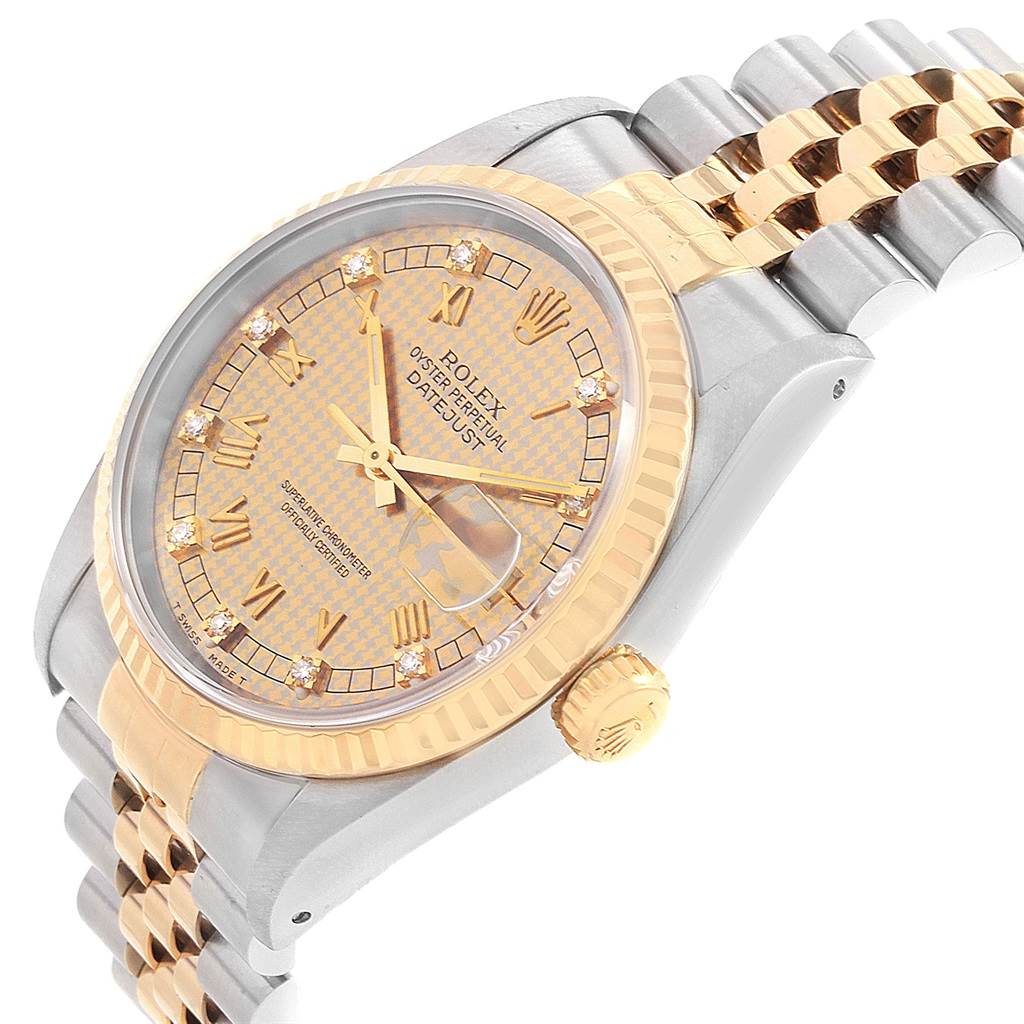 This image shows the dial, bezel, crown, and part of the bracelet of the Rolex Datejust 16233 Men's Steel and Gold (two tone) Champagne Dial 16233 Men's Steel and Gold (two tone) Champagne Dial watch from a side angle.