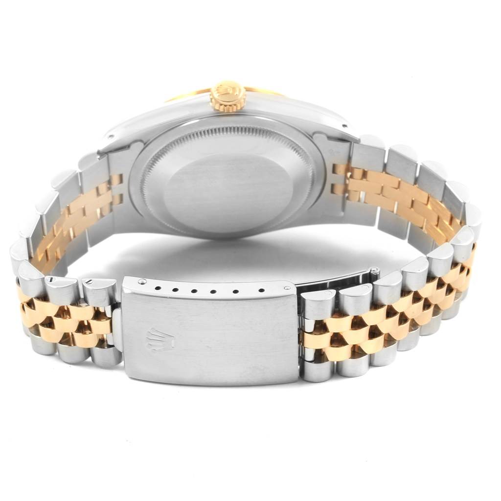 This image shows the backside of a Rolex Datejust 16233 Men's Steel and Gold (two tone) Champagne Dial 16233 Men's Steel and Gold (two tone) Champagne Dial watch, featuring the caseback and two-tone metal bracelet with a visible clasp.