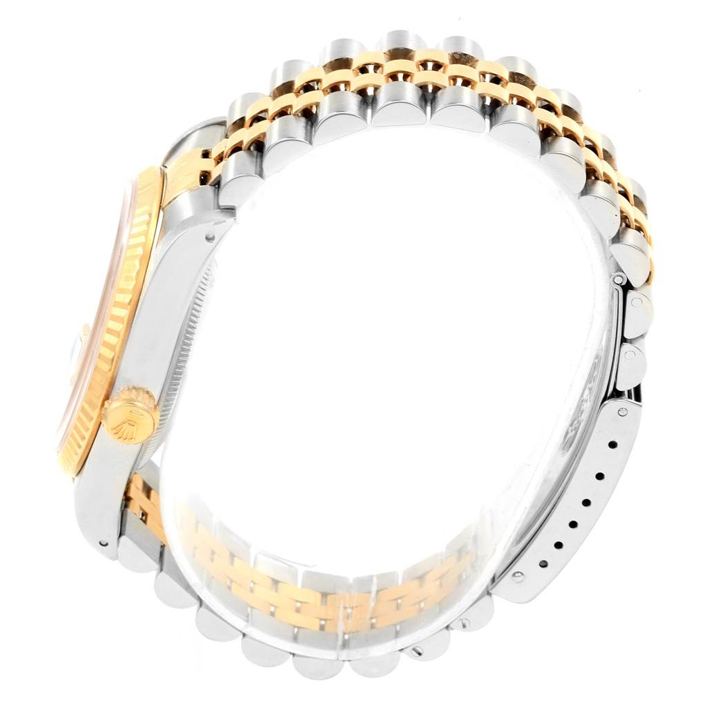 This image shows a side view of the Rolex Datejust 16233 Men's Steel and Gold (two tone) Champagne Dial 16233 Men's Steel and Gold (two tone) Champagne Dial watch, highlighting the crown, case, and two-tone bracelet.