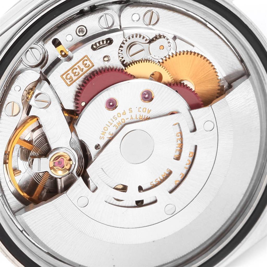 This image shows the internal mechanism of a Rolex Datejust 16234 Men's Stainless Steel White Dial 16234 Men's Stainless Steel White Dial watch from a close-up back angle, revealing gears and the rotor.