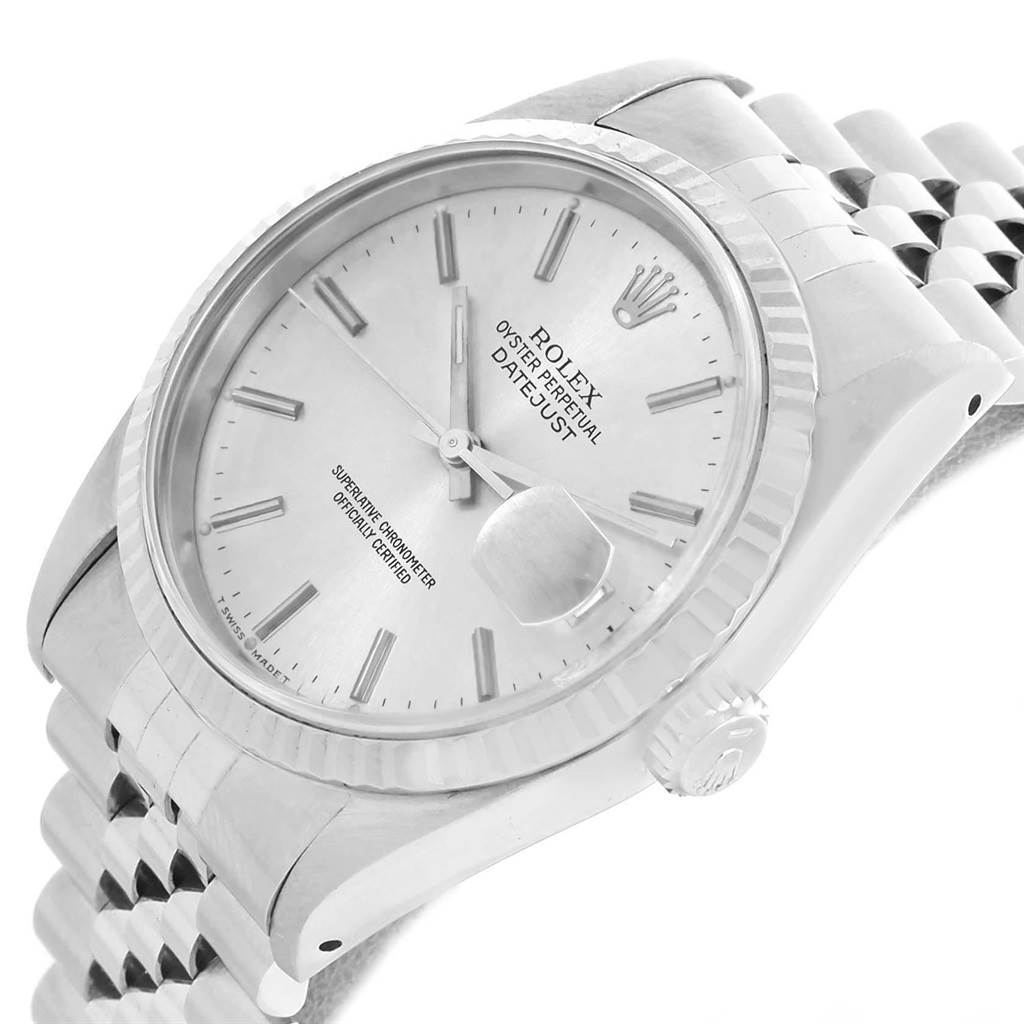 The Rolex Datejust 16234 Men's Stainless Steel White Dial 16234 Men's Stainless Steel White Dial watch is shown at an angled close-up, highlighting its dial, crown, bezel, and partial bracelet.