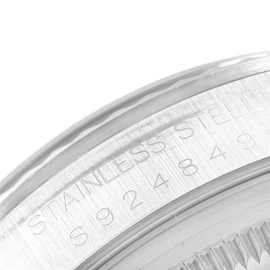 This close-up image shows the side of the bezel and the engraved serial number on a Rolex Datejust 16234 Men's Stainless Steel White Dial 16234 Men's Stainless Steel White Dial watch.