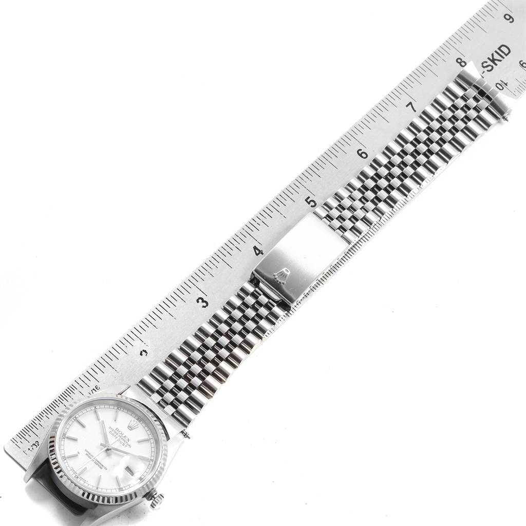 The image shows a Rolex Datejust 16234 Men's Stainless Steel White Dial 16234 Men's Stainless Steel White Dial watch laid out flat with a ruler measuring the length of its band.