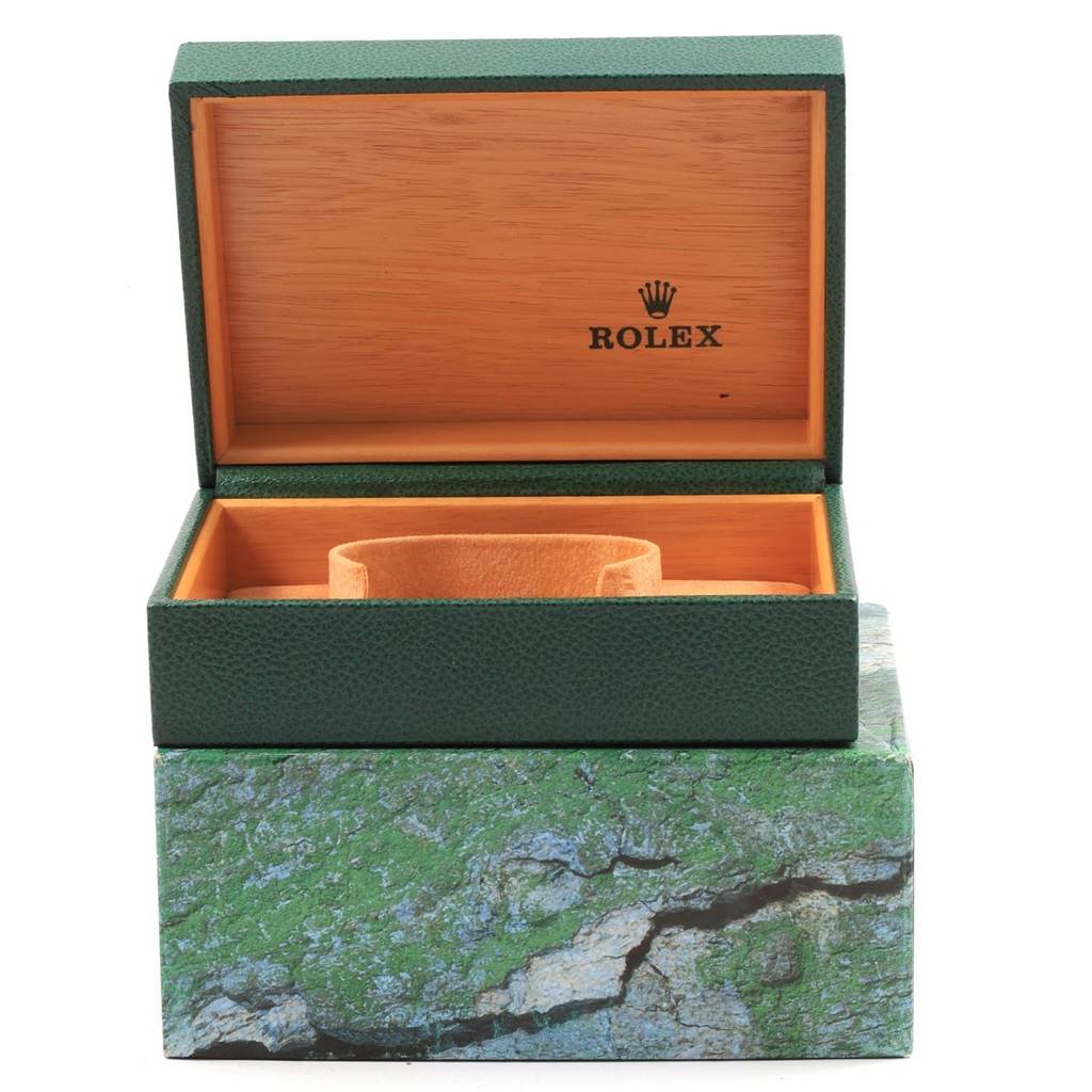The image shows an open green Rolex Datejust 16220 Men
s Stainless Steel Black Dial 16220 Men
s Stainless Steel Black Dial watch box with an orange interior and no watch inside.
