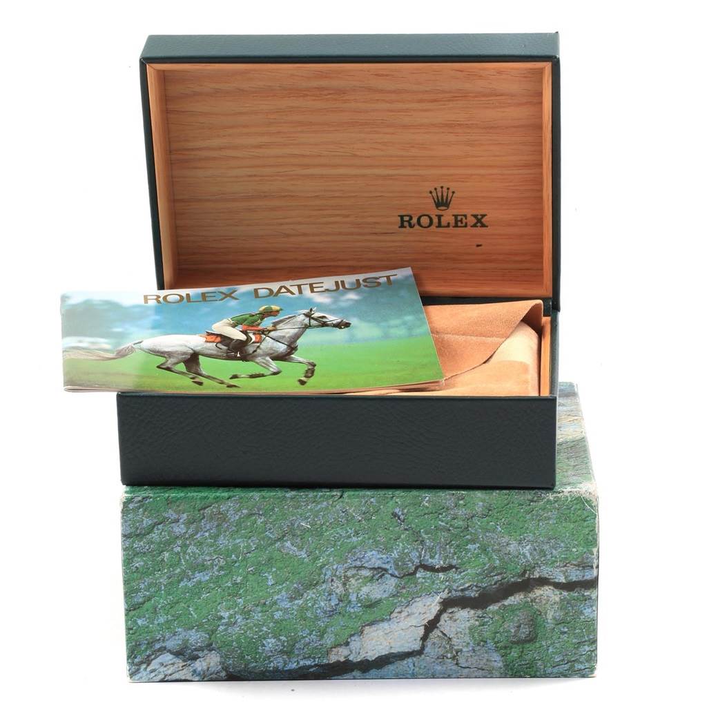 The image shows the inner and outer boxes, and a booklet for the Rolex Datejust 16233 Men's Steel and Gold (two tone) Champagne Dial 16233 Men's Steel and Gold (two tone) Champagne Dial model at an angled, partially opened view.