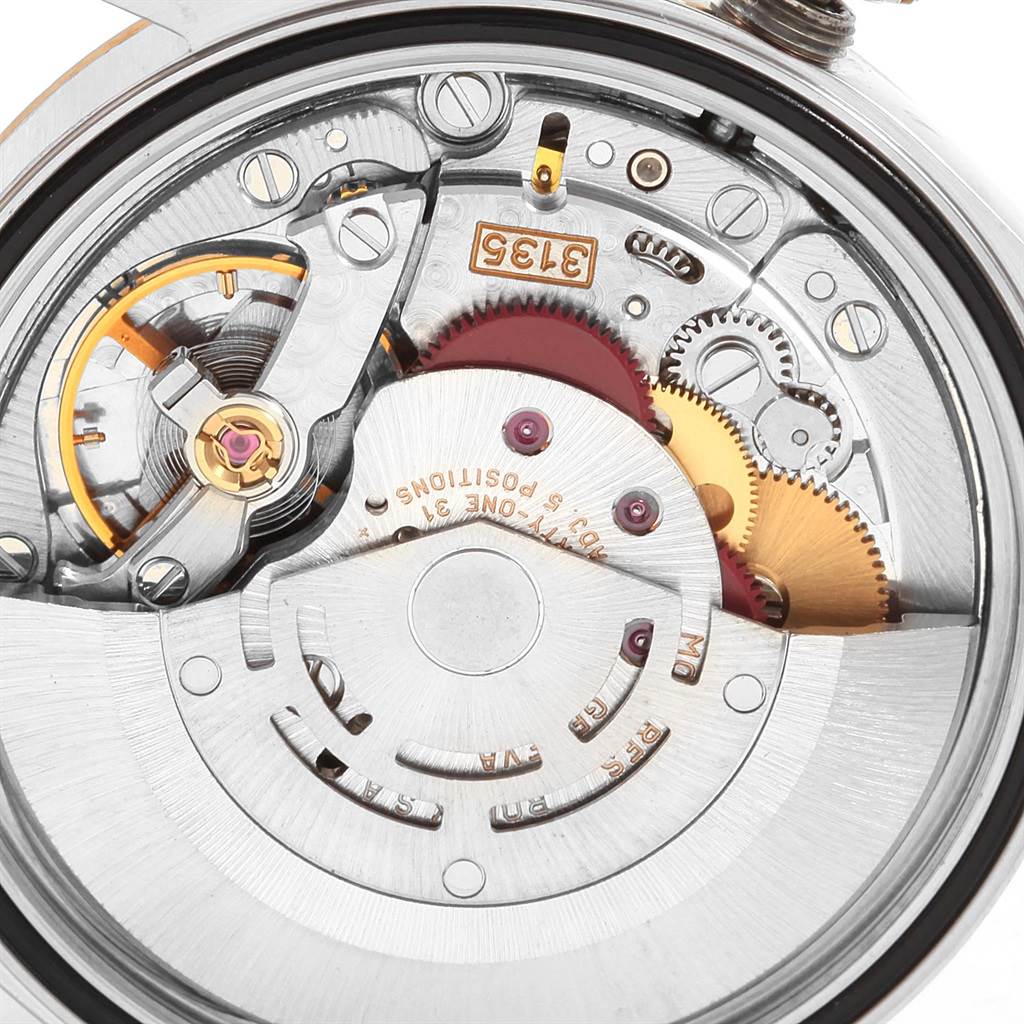 This image shows an angled close-up of the intricate internal movement components of a Rolex Datejust 16233 Men's Steel and Gold (two tone) Champagne Dial 16233 Men's Steel and Gold (two tone) Champagne Dial watch.