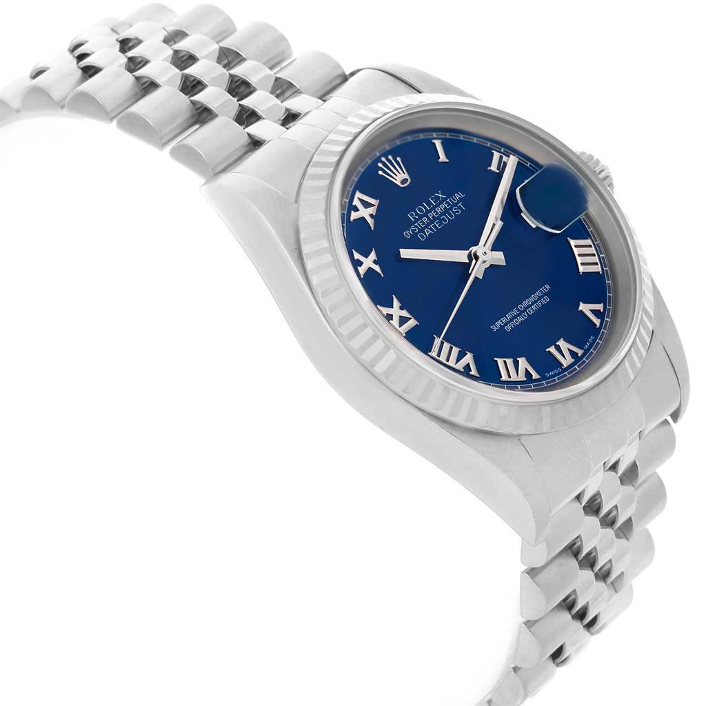 This image shows a side angle view of a Rolex Datejust 16234 Men's Stainless Steel Blue Dial 16234 Men's Stainless Steel Blue Dial watch, highlighting its blue dial, Roman numerals, and jubilee bracelet.